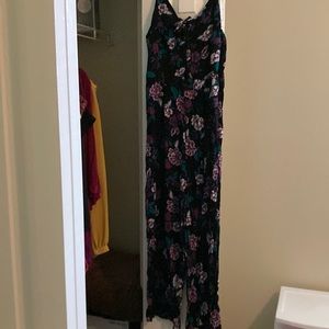 Never worn. Adjustable strap one piece jump suit